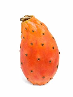 an orange fruit with black spots on it's skin, sitting upright against a white background