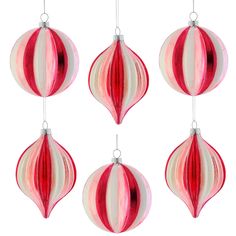 four red and white ornaments hanging from strings