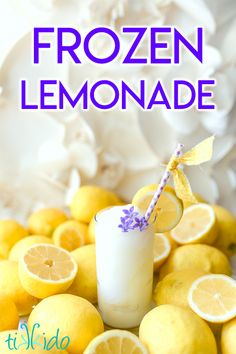 the cover of frozen lemonade is surrounded by sliced lemons and lavender sprigs