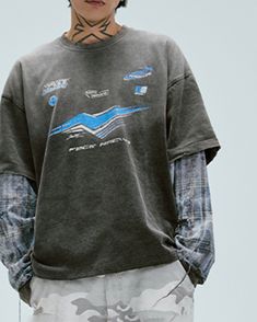 The Distressed Layered Washed Long-Sleeve Tee brings a bold, avant-garde touch to casual streetwear. Featuring a washed and distressed finish, this piece embodies a well-worn, vintage look with a modern twist. The front graphic print adds a unique focal point, while the classic crew neck design and slightly oversized fit offer a laid-back vibe. Crafted from premium 100% cotton fabric, this tee is both stylish and comfortable, making it a must-have for those who appreciate edgy, fashion-forward p Trendy Streetwear Shirt For Spring, Trendy Spring Streetwear Shirt, Crew Neck Shirt For Spring Streetwear, Spring Casual Streetwear Shirt, Relaxed Fit Top For Spring Streetwear, Streetwear Graphic Print Shirt For Spring, 90s Style Relaxed Fit Tops For Streetwear, Spring Streetwear Grunge Tops, Oversized Grunge Tops For Spring