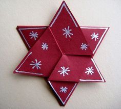 an origami star with snowflakes on it