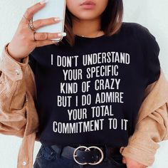 I Don't Understand Your Specific Kind Of Crazy Tee #wearingtoday #dailyparenting #workfromhomemom #momstyleblogger #millennialmom #hotmess #ltkstyletip #homeschoolmama #affordablestyle #women Meaningful Text Print Crew Neck Tops, Trendy Black Tops With Quote Print, Everyday Crew Neck Tops With Quote Print, Everyday Fall Slogan T-shirt, Fall Casual T-shirt With Funny Text, Funny Text Print Tops For Fall, Fall Slogan T-shirt For Everyday Wear, Trendy Quote Print T-shirt For Everyday, Trendy Quote Print T-shirt