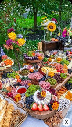 a table filled with lots of different types of food and desserts on it's sides