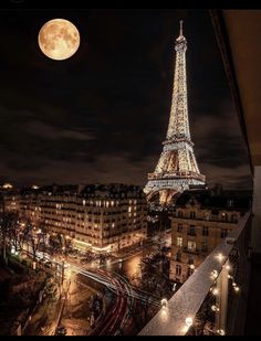 the eiffel tower is lit up at night