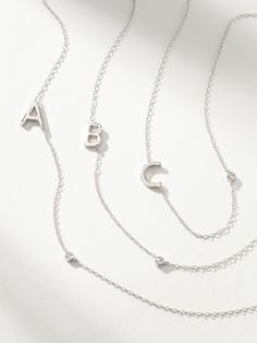 Add a touch of sparkle and a touch of personalization to your stack with this initial necklace. Coming in gold or Sterling Silver, this dainty chain necklace makes the perfect layering piece. For a full look, pair the Personalized Touch Necklace with anything from our Initial Jewelry Collection. | Sterling Silver Personalized Touch Initial Pendant Necklace with Letter A | Women's Jewelry by Uncommon James Uncommon James, Dainty Chain Necklace, Initial Pendant Necklace, Dainty Chain, Initial Jewelry, Full Look, Initial Pendant, Letter Necklace, Initial Letters