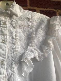 "Great vintage condition/no issues no stains/ has been sealed for years-Last time I wore this was in the 70s it is a fitted blouse possibly Gunne Sax no labels-pit to pit 19\" /waist 17 1/2\"/hips 19\"/pit to wrist 18 1/2\"/length (shoulder to bottom) 25\"/ Amazing Lace filled blouse-lace trimmed cuffs/wrist elastic is fully functional/No stains no holes or tears/smoke free environment (130)" Vintage Lace Blouse For Formal Occasions, Vintage Lace Top Blouse For Formal Occasions, Formal Vintage Blouse With Lace Top, Vintage Formal Blouse With Lace Top, Vintage Lace Top With Lace Trim For Formal Events, Vintage Lace Tops For Formal Occasions, Vintage Lace Top Blouse, Vintage Lace Top For Formal Occasions, Vintage Lace Blouse With Lace Top