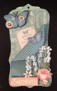 a card with flowers, butterflies and a tag that says'sweet heart'on it