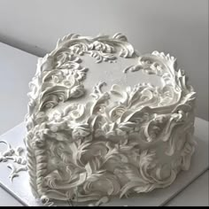 a large white cake sitting on top of a table