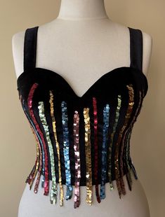 This Black Velvet corset, which we named Dancing Queen, was handcrafted individually in our workshops. Each model is worked on only one size and is personalized. The beads and materials on it were carefully selected and hand-sewn. Your cargo is carefully packed and sent to you. Size     : EU 36  / USA 4 / UK 8 / S Adjustable corset with back tie Dimensions are flexible 6 cm (2,5 in) Color   : Black Fitted Overbust Corset For Party, Black Overbust Bodice For Party, Fitted Multicolor Sleeveless Corset, Embellished Fitted Corset For Prom, Fitted Embellished Corset For Prom, Sequined Corset For Party Season, Party Overbust Corset With Corset Back, Sequined Fitted Corset For Party, Fitted Corset With Corset Back For Party Season