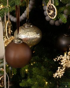 a christmas tree with ornaments hanging from it