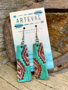 the earrings are made out of wood and turquoise