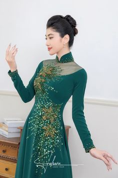 Traditional collar Material: Crepe, beading Long sleeves Type: Modern ao dai Elegant Embellished Long Sleeve Ao Dai, Traditional Embroidered Ao Dai For Party, Elegant Embroidered Ao Dai For Party, Fitted Long Sleeve Embellished Ao Dai, Embellished Fitted Long Sleeve Ao Dai, Elegant Long Sleeve Embroidered Ao Dai, Embroidered Long Sleeve Ao Dai For Party, Fitted Evening Ao Dai With Floral Embroidery, Festive Long Sleeve Cheongsam For Party