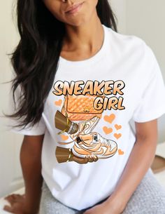 Orange Sneaker Girl design on a 100% cotton Bella canvas shirt Sporty Graphic Print Summer Sneakers, Sporty Sneakers With Graphic Print For Summer, Sporty Graphic Print Sneakers For Summer, Sporty T-shirt With Funny Print For Streetwear, White Casual Sneakers With Letter Print, Casual White Sneakers With Letter Print, Casual Sneakers With Letter Print, Casual Sneakers With Letter Print For Streetwear, Casual Sneakers With Graphic Print For Spring