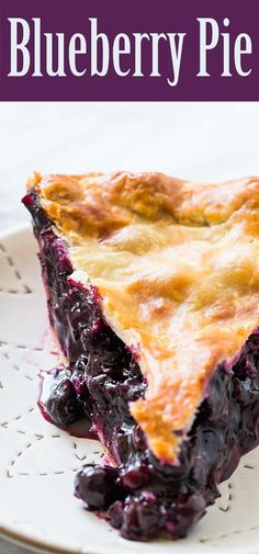 blueberry pie on a white plate with the title overlay reads, blueberry pie