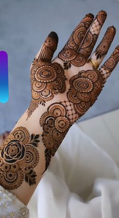 a woman's hand with henna on it and the logo for instagram