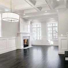 an empty living room with white walls and wood flooring is featured on the instagram page