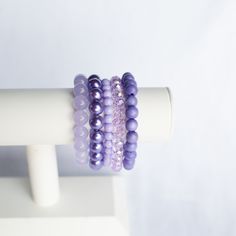 Discover the daring beauty of the Do You Lilac It Bracelet Stack. This purple monochromatic stack features five distinct bracelets to give you a daring and stylish look. HOC-Summer 084 violet jade 173 ice lavender pearl 781 lavender round 6mm 914 lavender ab 570 lavender wood Everyday Purple Round Beaded Bracelets, Trendy Purple Jewelry For Everyday, Trendy Everyday Purple Jewelry, Trendy Purple Everyday Jewelry, Adjustable Lavender Jewelry For Everyday, Everyday Purple Round Beads Bracelets, Purple Round Beaded Bracelet, Trendy Purple Beaded Bracelets For Everyday, Trendy Everyday Purple Beaded Bracelets