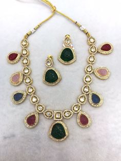 All our pieces are in stock and will be dispatched within 24 to 48 hours of order. Orders received during the weekend will be dispatched on Monday One of our favorite picks for the wedding season or festival season 2022❤️ Comes with an adjustable string Material: Brass and copper mix, gold polish, cz stones, polki Kundan, carved Quartz stones Multicolor Jewelry Sets With Intricate Design For Celebration, Elegant Multicolor Jewelry Sets For Weddings, Elegant Multicolor Kundan Necklace For Celebrations, Fusion Style Multicolor Bridal Necklace With Intricate Design, Formal Multicolor Kundan Necklaces, Elegant Multi-stone Necklaces For Festive Occasions, Elegant Festive Multi-stone Necklaces, Multicolor Fusion Bridal Necklace With Intricate Design, Elegant Multicolor Necklace For Festive Season