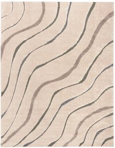 a beige rug with wavy lines on the top and bottom, along with grey accents