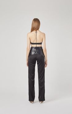 (7-14 business days Pre-Order) Made of vegan leather, these straight leg pants cut with a flattering high-waisted silhouette, pair yours with the matching Ms. Godet Leather Bra. Product Details: Professional Dry Clean Composition: Vegan leather , Light Silk Satin Proudly made in Thailand Size+Fits: XXS: Bust 29.5" Waist 22.5" Hips 33.5"XS: Bust 31.5” Waist 24.5” Hips 35.5”S: Bust 33.5” Waist 26” Hips 37”M: Bust 35.5” Waist 28” Hips 39”L: Bust 37.5" Waist 30" Hips 41"XL: Bust 39.5” Waist 32” Hips Fitted Leather Wide-leg Pants, Wide Leg Leather Pants For Going Out, High-waisted Leather Pants For Evening, Sleek Leather Evening Bottoms, Sleek Black Wide-leg Leather Pants, High Waist Leather Bottoms For Evening, Wide Leg Leather Bottoms For Evening, Leather Trousers For Evening, Sleek Leather Straight Pants With Belt Loops