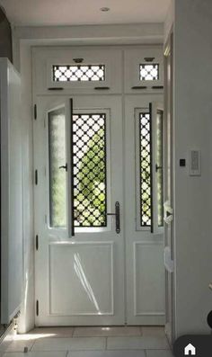 a white front door with two sidelights