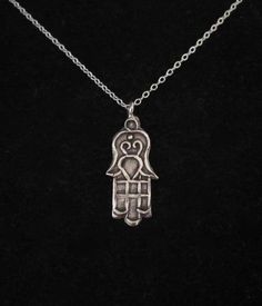 Oxidized 97% sterling silver etched FATIMA/HAMSA HAND pendant and 925 sterling silver necklace chain. Protection and Good Luck symbolPlease choose the length of the chain from the menu.Hilltribe 97% solid sterling silver hand-crafted pendant - 27mm x 11mm (1.06" x 0.43")(including the top ring)The necklace comes bubble wrapped and gift wrapped in a complementary organza bag. Silver Etched Sterling Silver Necklace, Etched Sterling Silver Necklaces, Symbolic Sterling Silver Engraved Charm Necklaces, Nickel-free Symbolic Sterling Silver Necklace, Spiritual Sterling Silver Etched Necklaces, Spiritual Etched Sterling Silver Necklaces, Spiritual Etched Sterling Silver Necklace, Sterling Silver Amulet Pendant Charm Necklace, Sterling Silver Pendant Amulet Charm Necklace