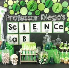 a science themed party with green and white decorations