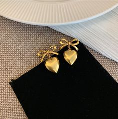 With effortless jewelry elevate your look✨only available at enroutejewelry.com😋 Modern Genshin, Genshin Dr, Simplistic Jewelry, Soft Jewelry, En Route Jewelry, Desk Room, Ribbon Heart, Fantasy Earrings, Simple Gold Earrings