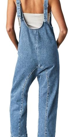 Made from high-quality denim fabric(85%Cotton,15%Polyester), these jumpsuits offer a rigid feel, adding a touch of ruggedness to the overall design while maintaining a fashionable appearance.The pant legs are designed in a harem style, offering a unique and flowing silhouette. The low scoop/deep v neckline highlights your neck and adds a touch of femininity.This jumpsuits for women dressy sexy also has adjustable low-back shoulder straps, allowing you to customize the fit as needed. Baggy Overalls, Baggy Jumpsuit, Denim Jumpsuits, Jeans Overall, High Roller, Effortlessly Chic Outfits, Denim Romper, Pullover Shirt, Komplette Outfits