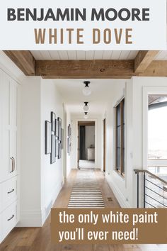 a hallway with white walls and wood floors is featured in an ad for benjamin moore's white dove