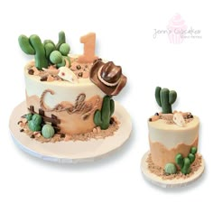 two cakes made to look like the desert are decorated with cactus and cowboy hats on top