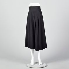 "This listing is for one skirt. Textile is unmarked. Full skirt with pleated waistband. This is a very lovely black skirt with a nice sweep. Beautiful drape and movement. Wide waistband with horizontal pleats. Left side zip with button and loop closures at the waistband. Size Marked: Unmarked Approximate Size: Medium **Please Check Measurements to be Sure! Fabric: Unmarked Lining Type: None Closure: Zip Label: Unmarked Condition: Excellent Era: 1950s Inventory#: DSC1018-1984 Measurements- Waist: A-line Evening Skirt With Box Pleat, Evening Full Skirt With Pleated Waist, Evening Full Pleated Skirt, Fitted Box Pleat Pleated Skirt For Evening, Evening Flared Skirt With Box Pleat, Black Bottoms With Pleated Waist For Evening, A-line Pleated Skirt For Evening, Classic Black Pleated Waist Skirt, Black Fitted Pleated Skirt With Box Pleat