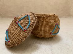 Hand woven Native American basket with a top and decorative beaded triangles in turquoise and red. It also has a little clasp made out of a seed with beads. I believe it was made by either the Hupa, Karok, or Yurok people of Northern California. You can read more here: https://genequintanafineart.com/catalog/?catalog=indian_baskets&category=hupakarokyurok Measures about 3 1/2" to 4" across and 3" to 3 1/2" tall. Lidded Basket, Native American Baskets, Indian Baskets, Lidded Baskets, Decorative Baskets, Basket Decoration, Decorative Storage, Northern California, Hand Woven