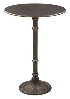 a round table with metal pedestals and an ornate design on the top, against a white background