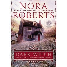 the cover of dark witch by nora roberts, with an image of a house in the background