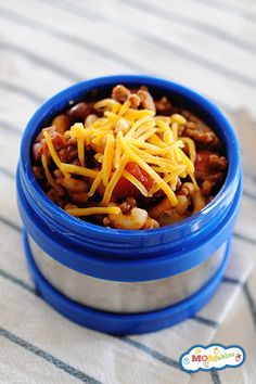 a blue container filled with chili and cheese