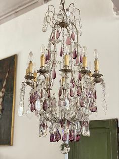 a chandelier hanging from the ceiling in a room