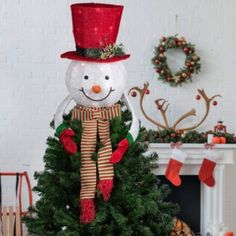 No Christmas is complete without a snowman making this unique find a must have this season. Decked out in a red top hat and matching striped scarf this tree topper is ready for the winter weather. Warm white lights offer the perfect amount of holiday glow. Product Features: Lighted snowman tree topper Pre-lit with 20 warm white lights Bulb size: mini Bulb type: incandescent 00" white lead cord If one bulb burns out the rest will stay lit Bendable wire in the arms for easy shaping Comes with repl Top Hat Christmas Tree Topper, Hat Christmas Tree Topper, Top Hat Christmas Tree, Red Top Hat, Snowman Christmas Tree Topper, Snowman Tree Topper, Lighted Snowman, Snowmen Crafts, C9 Christmas Lights