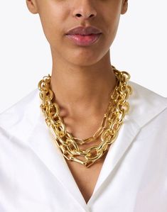 Make a statement in this luxe chain necklace from Kenneth Jay Lane. Featuring three different shapes and sizes of chain, layering has never been easier. Add sparkle and drama to your everyday look by pairing this necklace with a crisp white shirt and more chunky gold jewelry. Chic Gold-tone Chain Link Necklaces, Gold-tone Chain Link Chic Necklaces, Luxury Gold-tone Chain Necklace With Chunky Chain, Yellow Gold Polished Chain Link Necklace, Chunky Gold Jewelry, Gold-tone Chain Link Necklace In Brass, Gold Chain Link Necklace, Crisp White Shirt, Chain Link Necklace