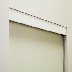 an open window in a white room