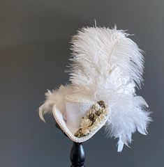 DreamsHead presents its novelty Beautiful mini tricorn Marie Antoinette white wedding Covered with a white brocade fabric, a stripe and white ribbon It is adorned with ostrich feathers and mini flowers Fully handmade It is will adorn your head with elegance and sublimate your outfit All my items are entirely handmade by me The color of the item may differ from your screen due to variance in computer monitors. The hats hold on the head by a rubber band, to pass through the back of the head up to White Brocade Fabric, Wedding Top Hat, Pirate Wedding, Ivory Bridal Gown, Pirate Hat, Steampunk Wedding, Tea Party Hats