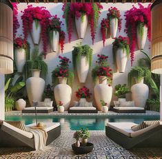 an outdoor area with large vases and chairs next to a swimming pool filled with flowers