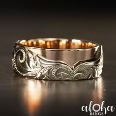 a wedding band with an intricate design on it