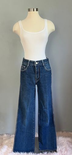 These beauties are 1980's vintage straight leg dark wash with white stitching Jordache jeans. There in GREAT condition. The denim is sturdy and the cut is flattering.  The measurement are taken laying flat: 28" waist  30" inseam  16" leg opening  17" across the hip  11" rise in front  12" rise in back Thanks for looking and please convo me any questions. Denim Cropped Straight Leg Jeans With Contrast Stitching, Cropped Leg Dark Wash Flare Jeans With Contrast Stitching, Dark Wash Cropped Leg Flare Jeans With Contrast Stitching, Dark Wash Flare Jeans With Contrast Stitching, Cropped Leg, Dark Wash Cropped Jeans With Contrast Stitching, Dark Wash Cropped Denim Jeans With Contrast Stitching, Mid-rise Flare Jeans With Contrast Stitching In Medium Wash, High-rise Cropped Denim Jeans With Contrast Stitching, High Rise Cropped Jeans With Contrast Stitching