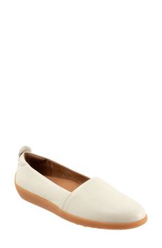 A streamlined silhouette adds timeless appeal to a versatile flat grounded by a cushioned footbed and durable rubber sole. Slip-on style with elastic gore inset Cushioned footbed with arch support Leather upper and lining/rubber sole Imported White Slip-ons With Ortholite Insole And Flat Heel, White Leather Slip-ons With Ortholite Insole, Leather Flats With Arch Support And Round Toe, Comfortable White Flats With Cushioned Footbed, Comfortable Leather Flats With Ortholite Insole, Comfortable Low-top Flats With Branded Insole, Medium Width Low-top Flats With Removable Insole, Modern White Flats With Removable Insole, White Slip-on Flats With Leather Footbed