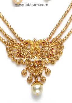 22 Karat Gold 'Peacock' Necklace & Drop Earrings Set with Uncut Diamonds,Ruby & South Sea Pearls
   - 235-DS436 - in 55.800 Grams for USD $6425.42. 
Made in India by Totaram Jewelers Online this product is in Gold - 22 Karat BIS Hallmark 916 KDM Gold  & is an excellent gift for Adult - Women. Ships fully insured with secured guaranteed delivery for free with your order over $250 from New Jersey USA & comes with 30 days exchange policy. Uncut Diamond Necklace, Diamond Necklace Indian, 22k Gold Necklace, Temple Jewelry Necklace, Peacock Jewelry, Gold Peacock, Peacock Necklace, 22k Gold Jewelry, Diamond Tennis Necklace