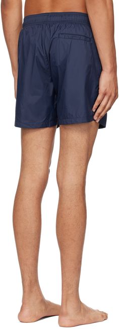 Nylon faille swim shorts. · Drawstring at elasticized waistband · Three-pocket styling · Logo printed at front · Mesh briefs-style underlay Supplier color: Dark blue Navy Nylon Shorts, Navy Drawstring Shorts, Navy Drawstring Bottoms Short Length, Navy Nylon Short Bottoms, Navy Shorts For Poolside, Nylon Short Swim Trunks For Pool, Short Nylon Swim Trunks For Pool, Navy Nylon Shorts For Summer, Nylon Beachwear Bottoms With Pockets