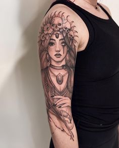 a woman with a tattoo on her arm