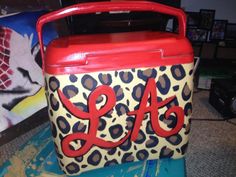 an animal print lunch box with the number 34 painted on it's front and side