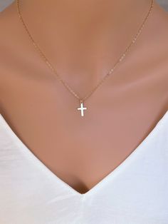 Dainty 14k Gold fill Cross Necklace Woman. Super cute small cross necklace is great gift for her Christmas, This necklace is made of.... -14k gold fill 15mm cross pendent, and -14k gold fill cable chain with spring clasp, -Come up with beautiful ribbon gift box and -One set of Care instruction package. MORE CROSS JEWELRY https://www.etsy.com/shop/rainbowearring?search_query=CROSS MORE LAYERED NECKLACES https://www.etsy.com/shop/rainbowearring1?section_id=17891444&ref=shopsection_leftnav_5 CO Dainty 14k Gold Cross Necklace, Dainty 14k Gold Cross Necklace For Everyday, Dainty Everyday 14k Gold Cross Necklace, Dainty 14k Gold Cross Necklace With Delicate Chain, Simple Everyday Cross Jewelry, Simple Cross Jewelry With Delicate Chain, Simple Gold Cross Necklace For Everyday, Dainty 14k Gold Cross Charm Necklace, Dainty 14k Gold Cross Pendant Charm Necklace